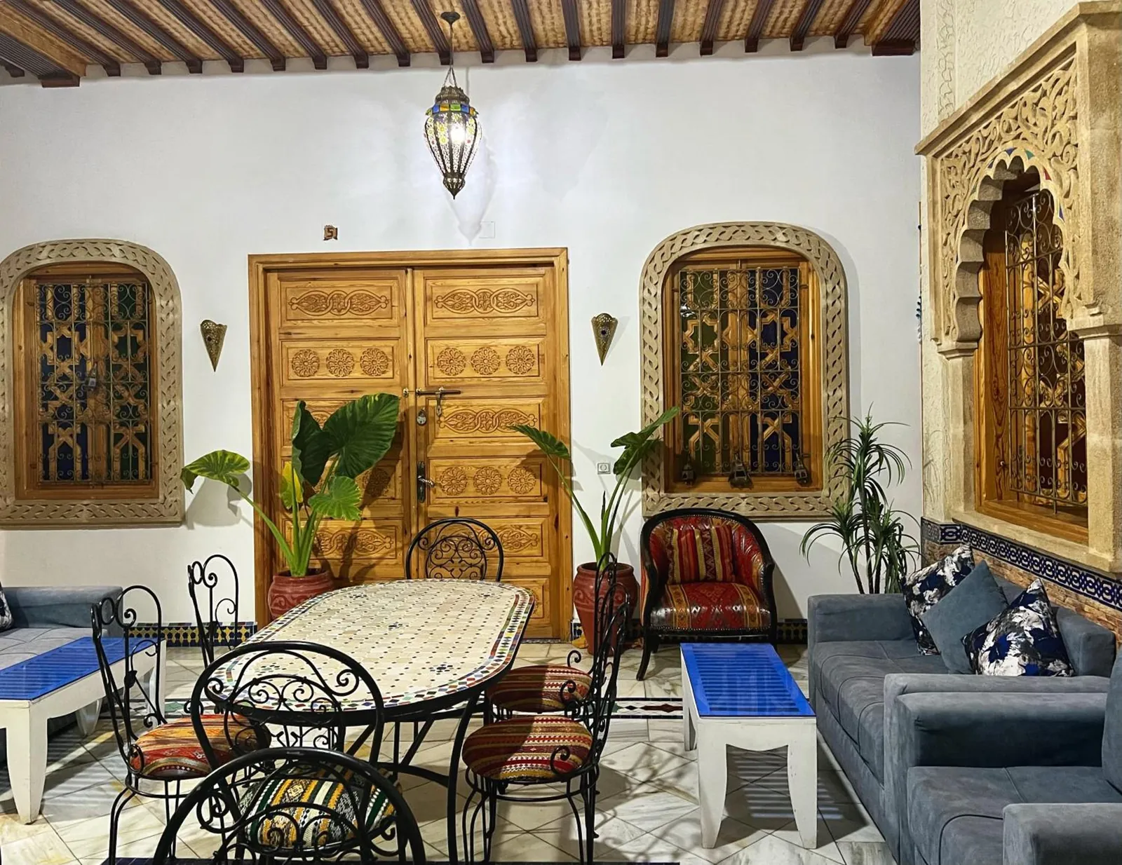 The patio sitting room and its carved cedar doors