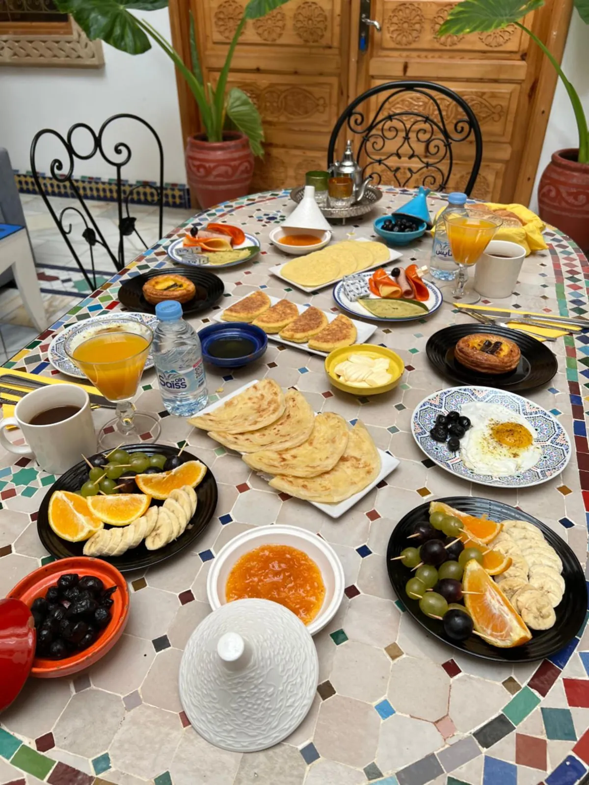 Breakfast, msemen, pancakes and orange juice
