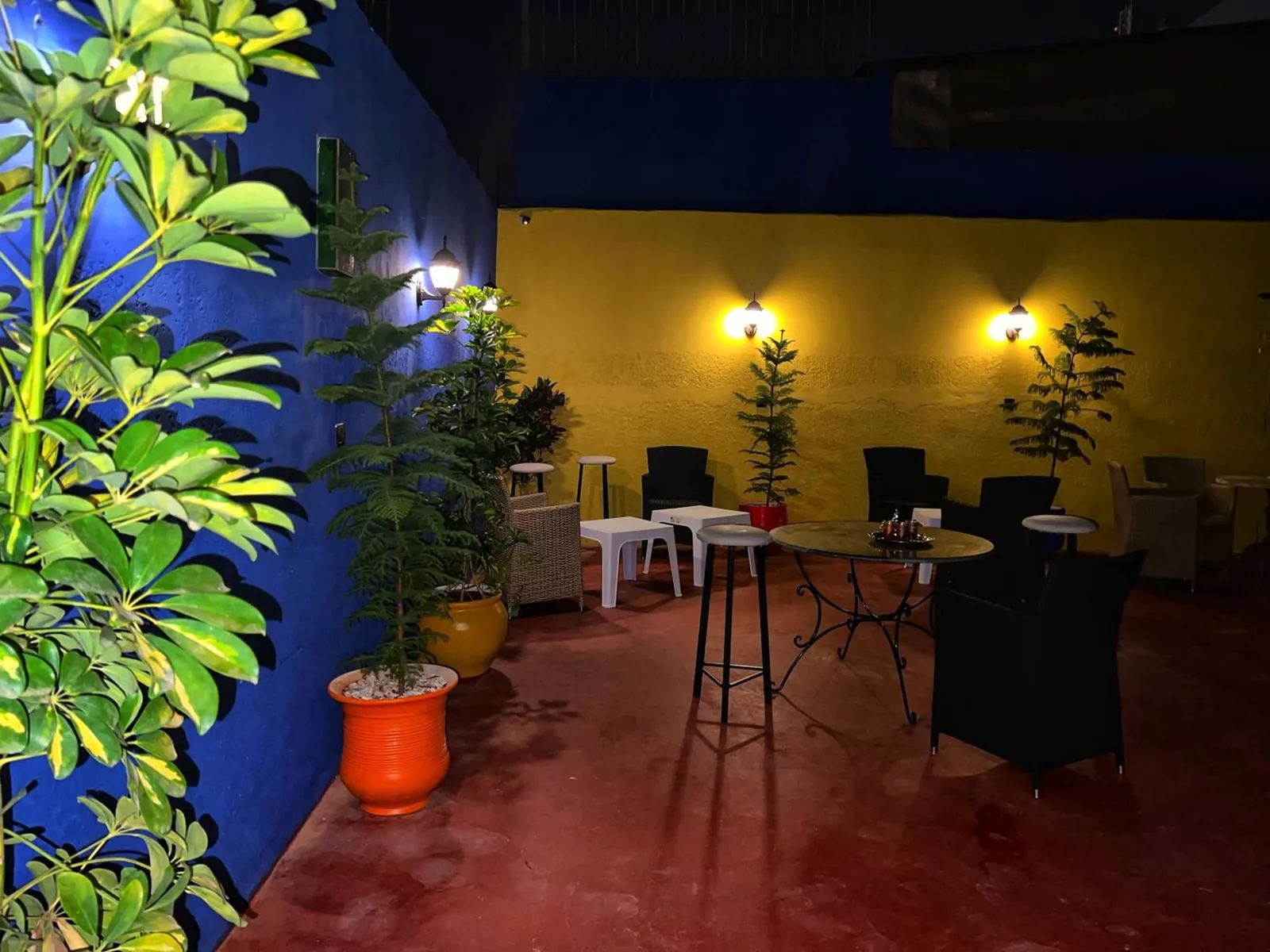 The terrace at night, blue and yellow walls