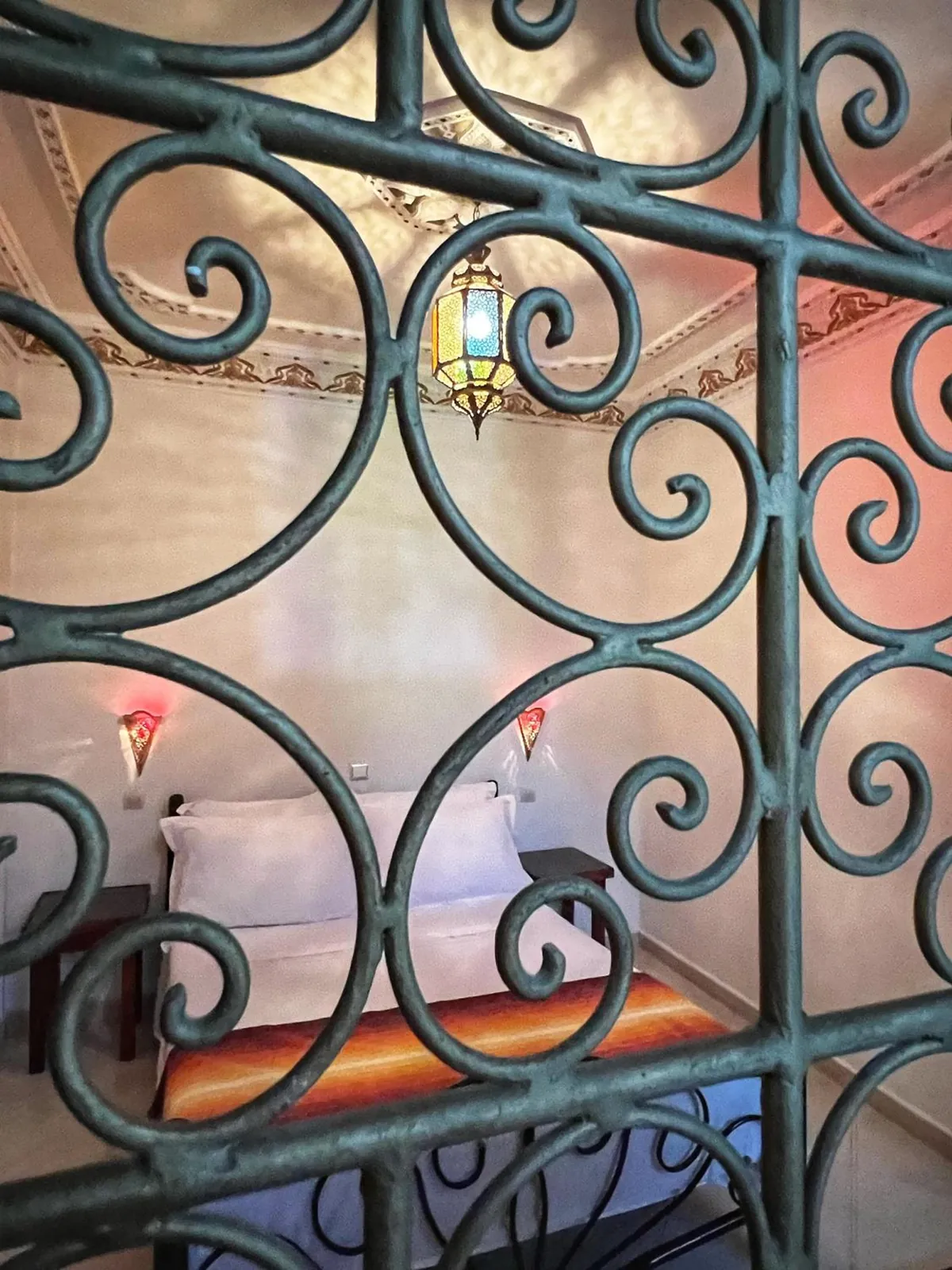 A room seen through the wrought-iron grille