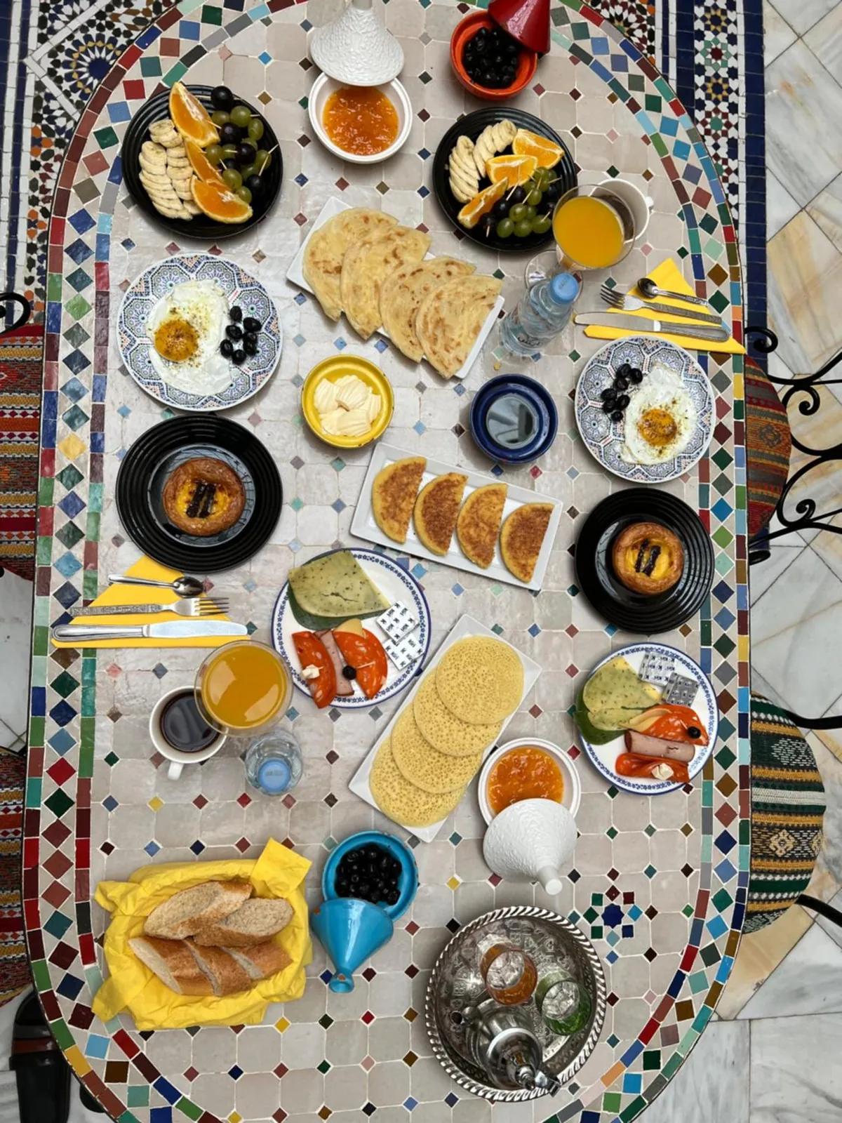 Breakfast from above, on the oval zellige table