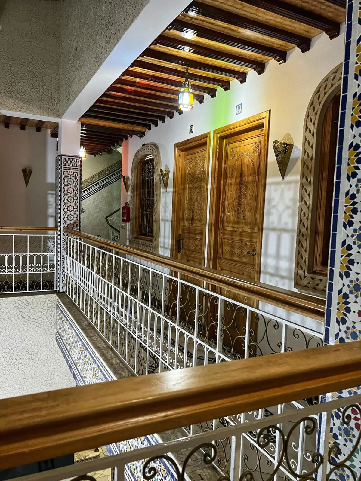 The upstairs gallery and the room doors